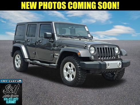 Used 2014 Jeep Wrangler Unlimited Sahara AWD/4WD image 1