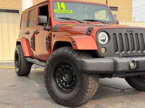 Used 2014 Jeep Wrangler Unlimited Sahara w/ Dual Top Group AWD/4WD image 2