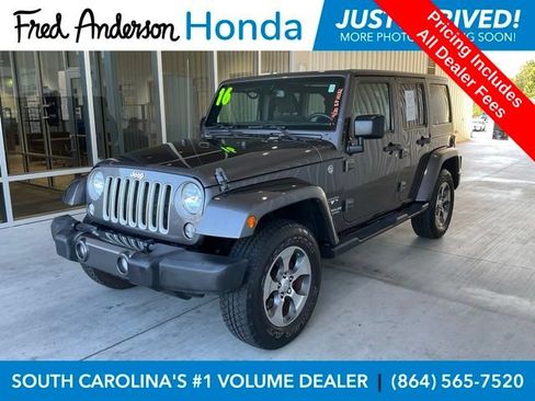 Used 2016 Jeep Wrangler Unlimited Sahara w/ Dual Top Group AWD/4WD image 1
