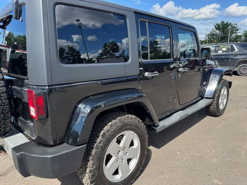 Used 2012 Jeep Wrangler Unlimited Sahara w/ Dual Top Group AWD/4WD image 11
