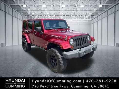 Used 2012 Jeep Wrangler Unlimited Rubicon w/ Dual Top Group AWD/4WD image 1