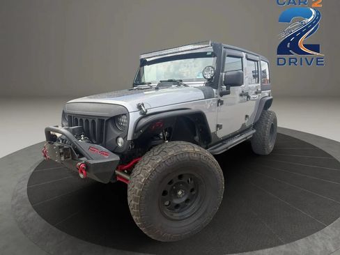 Used 2014 Jeep Wrangler Unlimited Sahara AWD/4WD image 1