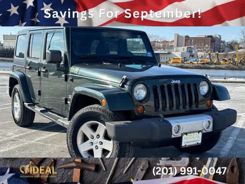 Used 2011 Jeep Wrangler Unlimited Sahara w/ Dual Top Group AWD/4WD image 1