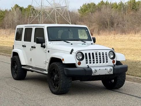 Used 2013 Jeep Wrangler Unlimited Sahara w/ Dual Top Group AWD/4WD image 1