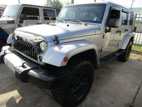 Used 2014 Jeep Wrangler Unlimited Sahara w/ Dual Top Group image 1