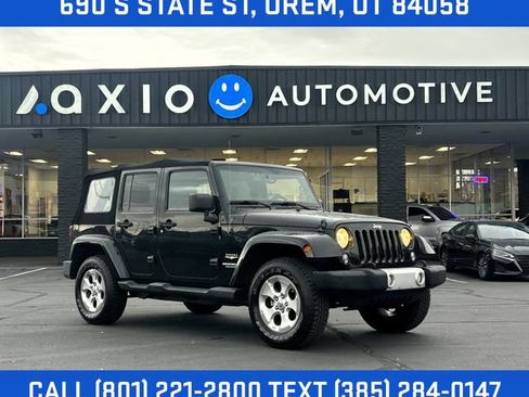 Used 2014 Jeep Wrangler Unlimited Sahara w/ Dual Top Group AWD/4WD image 1