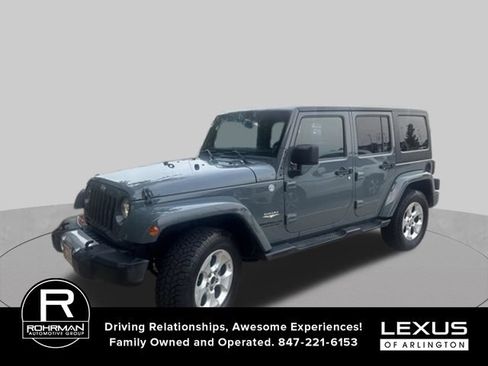 Used 2014 Jeep Wrangler Unlimited Sahara w/ Dual Top Group AWD/4WD image 1
