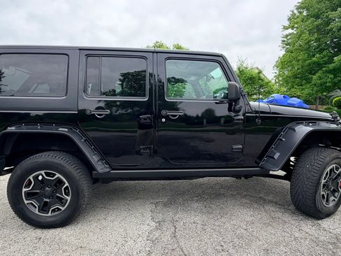Used 2014 Jeep Wrangler Unlimited Sahara w/ Dual Top Group AWD/4WD image 6