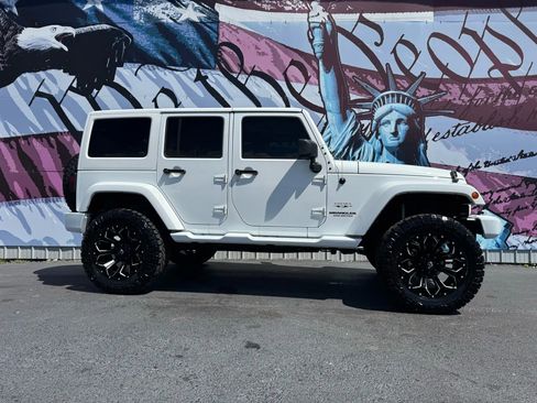 Used 2016 Jeep Wrangler Unlimited Sahara w/ Connectivity Group image 1