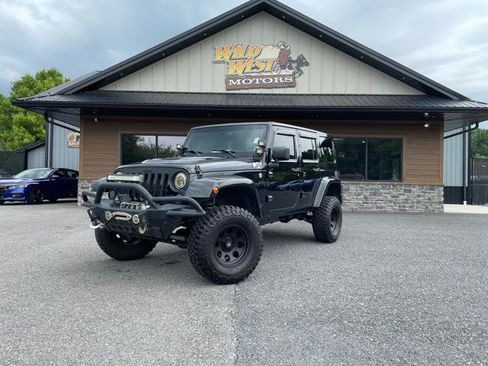 Used 2015 Jeep Wrangler Unlimited Sahara AWD/4WD image 1