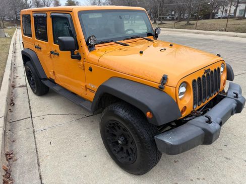 Used 2012 Jeep Wrangler Unlimited Sahara w/ Dual Top Group image 1