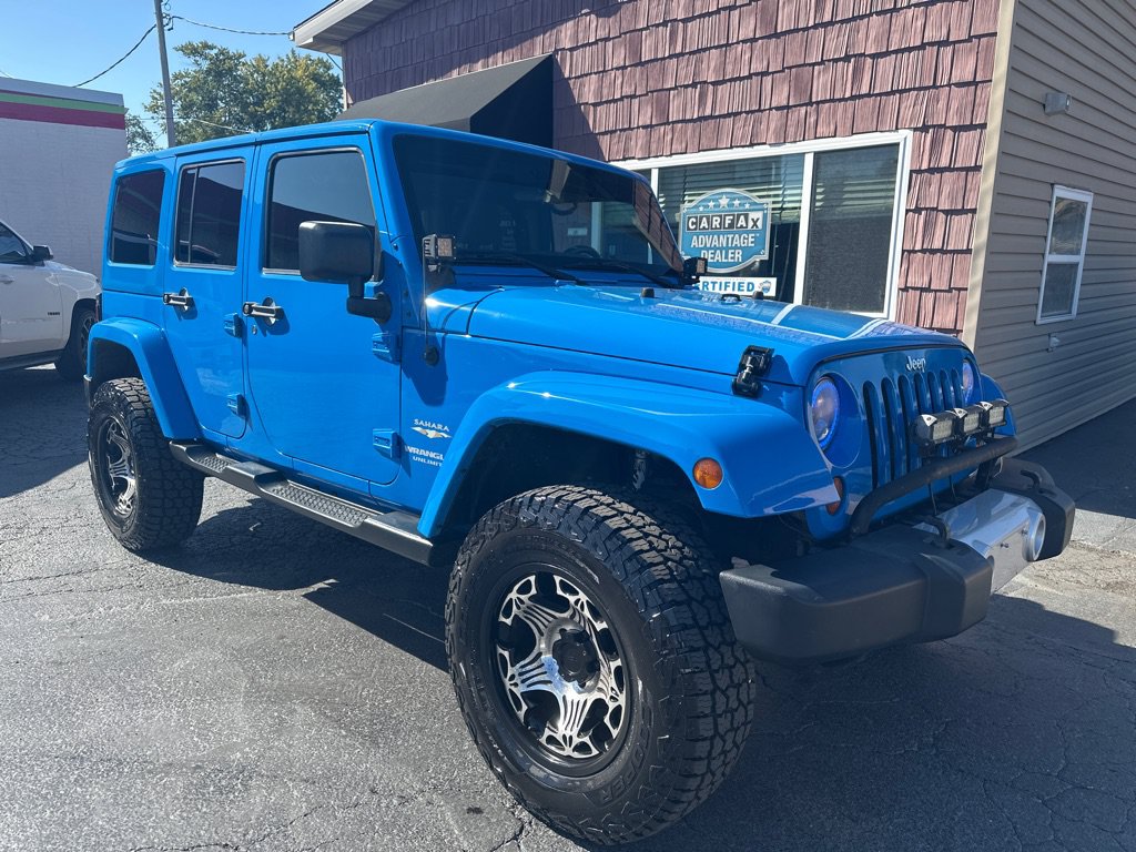 Used 2011 Jeep Wrangler Unlimited Sahara w/ Dual Top Group AWD/4WD image 1