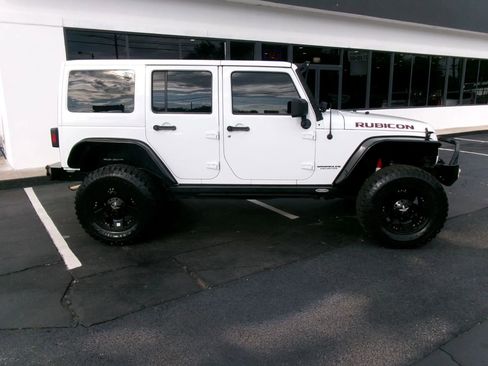Used 2013 Jeep Wrangler Unlimited Rubicon w/ Dual Top Group AWD/4WD image 2