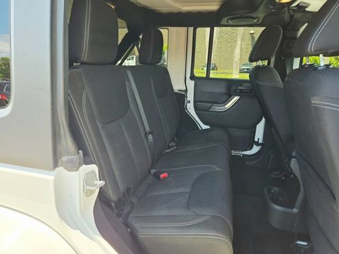 Used 2014 Jeep Wrangler Unlimited Sahara w/ Dual Top Group AWD/4WD image 16