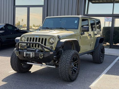 Used 2013 Jeep Wrangler Unlimited Rubicon w/ Dual Top Group AWD/4WD image 1