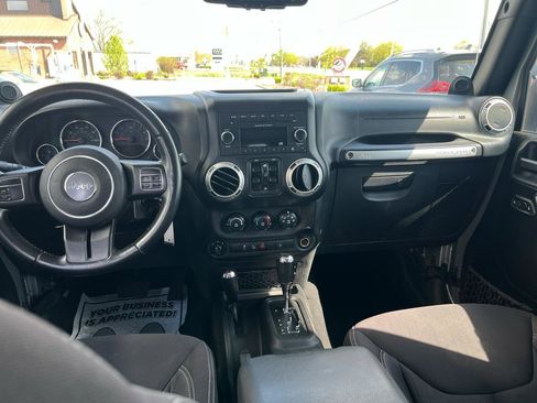 Used 2013 Jeep Wrangler Unlimited Sahara w/ Dual Top Group AWD/4WD image 14