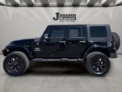 Used 2009 Jeep Wrangler Unlimited Sahara w/ Mopar Leather Group AWD/4WD image 1