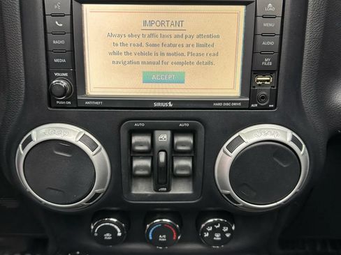 Used 2012 Jeep Wrangler Unlimited Sahara w/ Dual Top Group AWD/4WD image 16