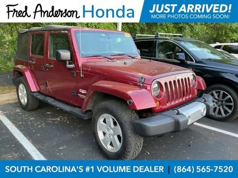 Used 2012 Jeep Wrangler Unlimited Sahara w/ Max Tow Pkg image 1