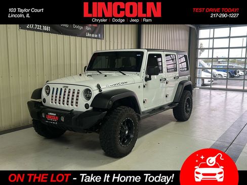 Used 2011 Jeep Wrangler Unlimited Rubicon w/ Dual Top Group AWD/4WD image 1