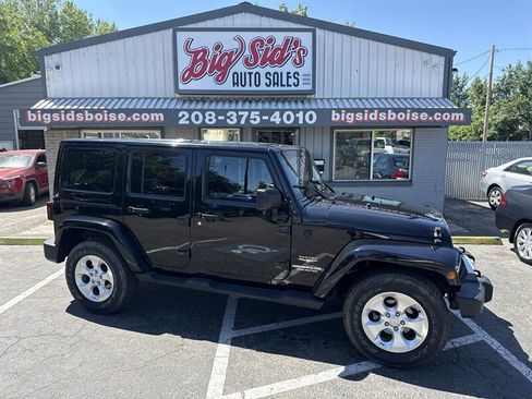 Used 2012 Jeep Wrangler Unlimited Sahara AWD/4WD image 1