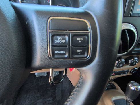 Used 2014 Jeep Wrangler Unlimited Sahara w/ Dual Top Group AWD/4WD image 22