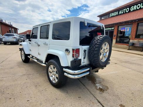 Used 2012 Jeep Wrangler Unlimited Sahara w/ Dual Top Group AWD/4WD image 6