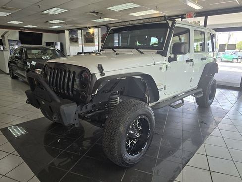 Used 2015 Jeep Wrangler Unlimited Sahara w/ Dual Top Group AWD/4WD image 1