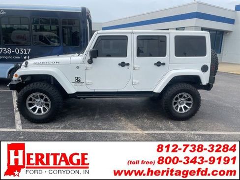 Used 2012 Jeep Wrangler Unlimited Rubicon w/ Dual Top Group AWD/4WD image 1