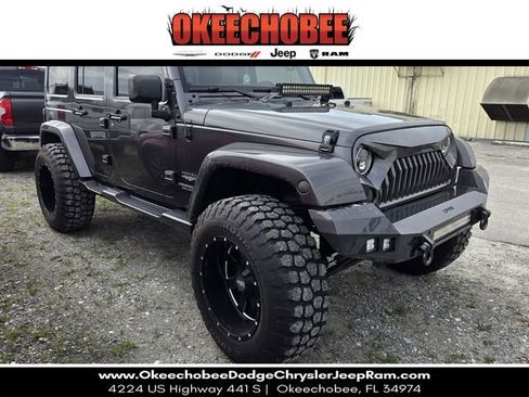 Used 2014 Jeep Wrangler Unlimited Sahara w/ Max Tow Package AWD/4WD image 1