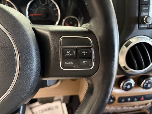 Used 2014 Jeep Wrangler Unlimited Sahara w/ Dual Top Group AWD/4WD image 12