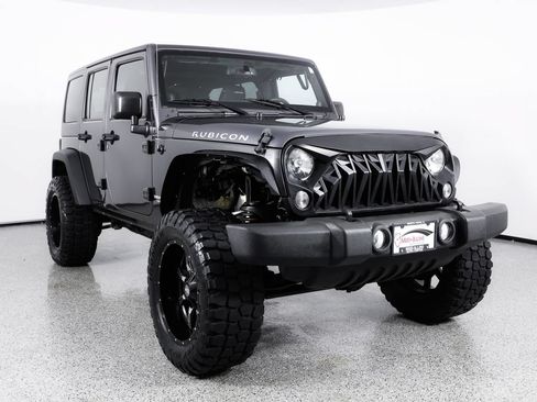 Used 2014 Jeep Wrangler Unlimited Rubicon w/ Dual Top Group AWD/4WD image 11