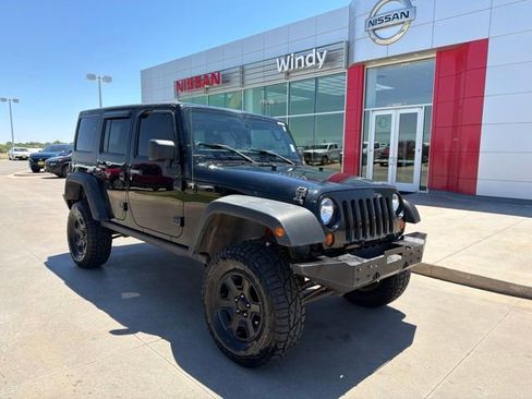 Used 2012 Jeep Wrangler Unlimited Rubicon w/ Dual Top Group AWD/4WD image 1