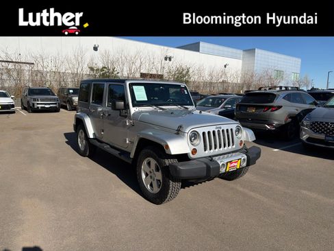 Used 2012 Jeep Wrangler Unlimited Sahara w/ Dual Top Group AWD/4WD image 1