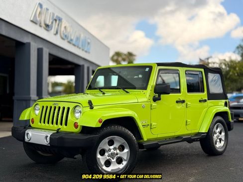 Used 2013 Jeep Wrangler Unlimited Sahara w/ Dual Top Group AWD/4WD image 1