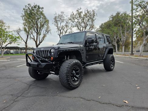 Used 2013 Jeep Wrangler Unlimited Sport AWD/4WD image 1