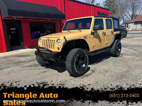 Used 2013 Jeep Wrangler Unlimited Sport w/ Mopar Black Appearance Group image 1