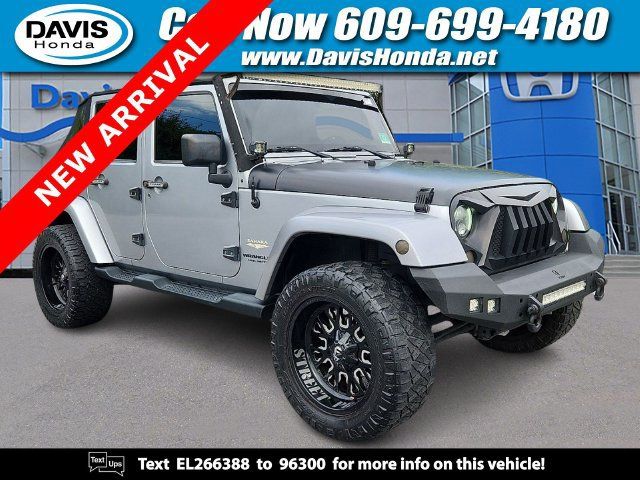 Used 2014 Jeep Wrangler Unlimited Sahara w/ Connectivity Group AWD/4WD image 1