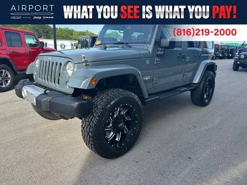Used 2014 Jeep Wrangler Unlimited Sahara w/ Max Tow Package AWD/4WD image 1