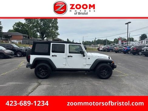 Used 2013 Jeep Wrangler Unlimited Sahara AWD/4WD image 1