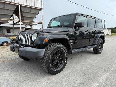 Used 2016 Jeep Wrangler Unlimited Sahara AWD/4WD image 1