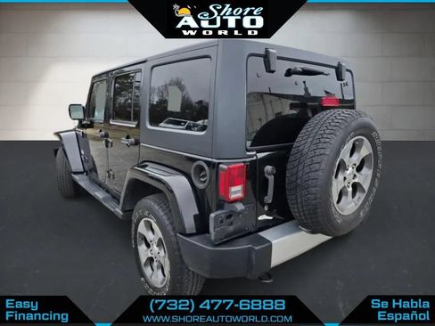 Used 2014 Jeep Wrangler Unlimited Sahara w/ Dual Top Group AWD/4WD image 7