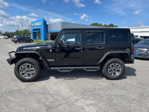 Used 2013 Jeep Wrangler Unlimited Rubicon w/ Dual Top Group AWD/4WD image 2