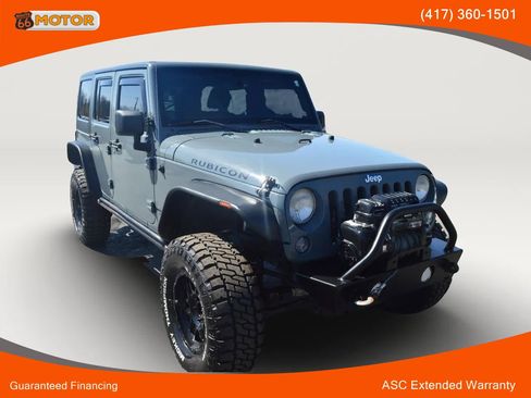 Used 2014 Jeep Wrangler Unlimited Rubicon w/ Dual Top Group AWD/4WD image 1