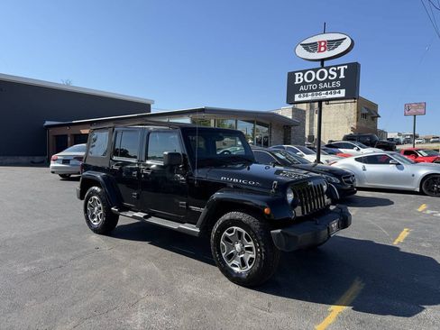 Used 2014 Jeep Wrangler Unlimited Rubicon w/ Dual Top Group AWD/4WD image 1