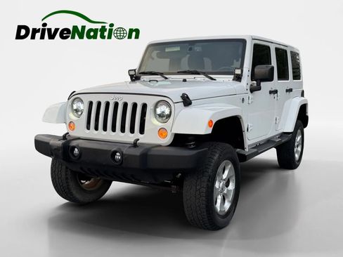 Used 2015 Jeep Wrangler Unlimited Sahara w/ Dual Top Group AWD/4WD image 1
