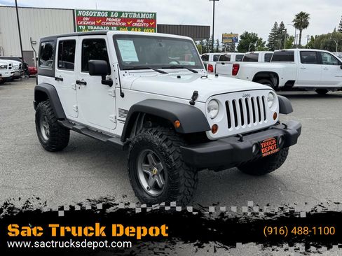 Used 2013 Jeep Wrangler Unlimited Sport AWD/4WD image 1