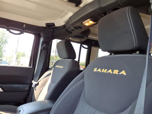 Used 2014 Jeep Wrangler Unlimited Sahara w/ Dual Top Group AWD/4WD image 16