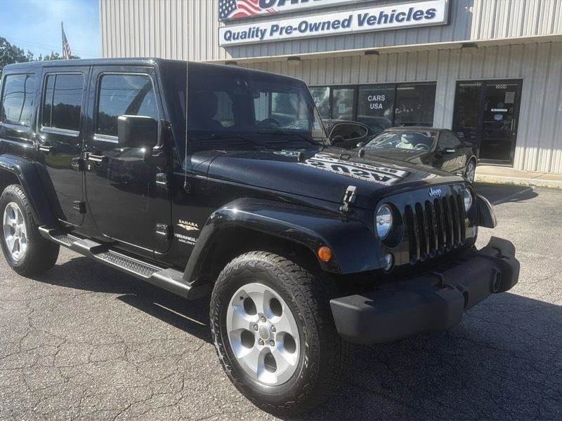 Used 2014 Jeep Wrangler Unlimited Sahara w/ Dual Top Group AWD/4WD image 2