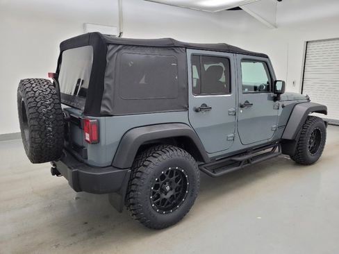 Used 2014 Jeep Wrangler Unlimited Rubicon w/ Dual Top Group AWD/4WD image 10